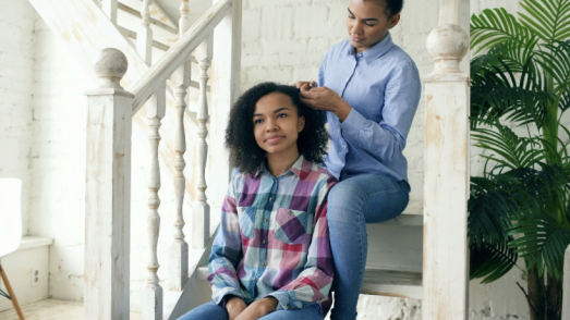 Parent talking openly with their child about love and relationships in a calm, supportive setting
